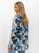Blue button-up shirt with painted flowers.