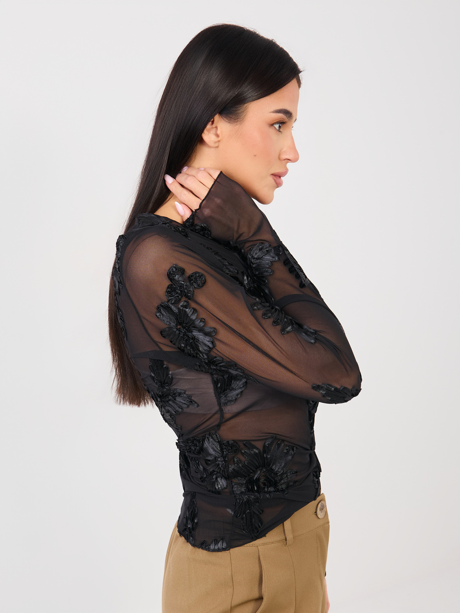 Black mesh blouse with long sleeves.