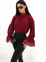 Burgundy blouse with a neck tie.