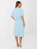 Light blue muslin dress with a tied belt.