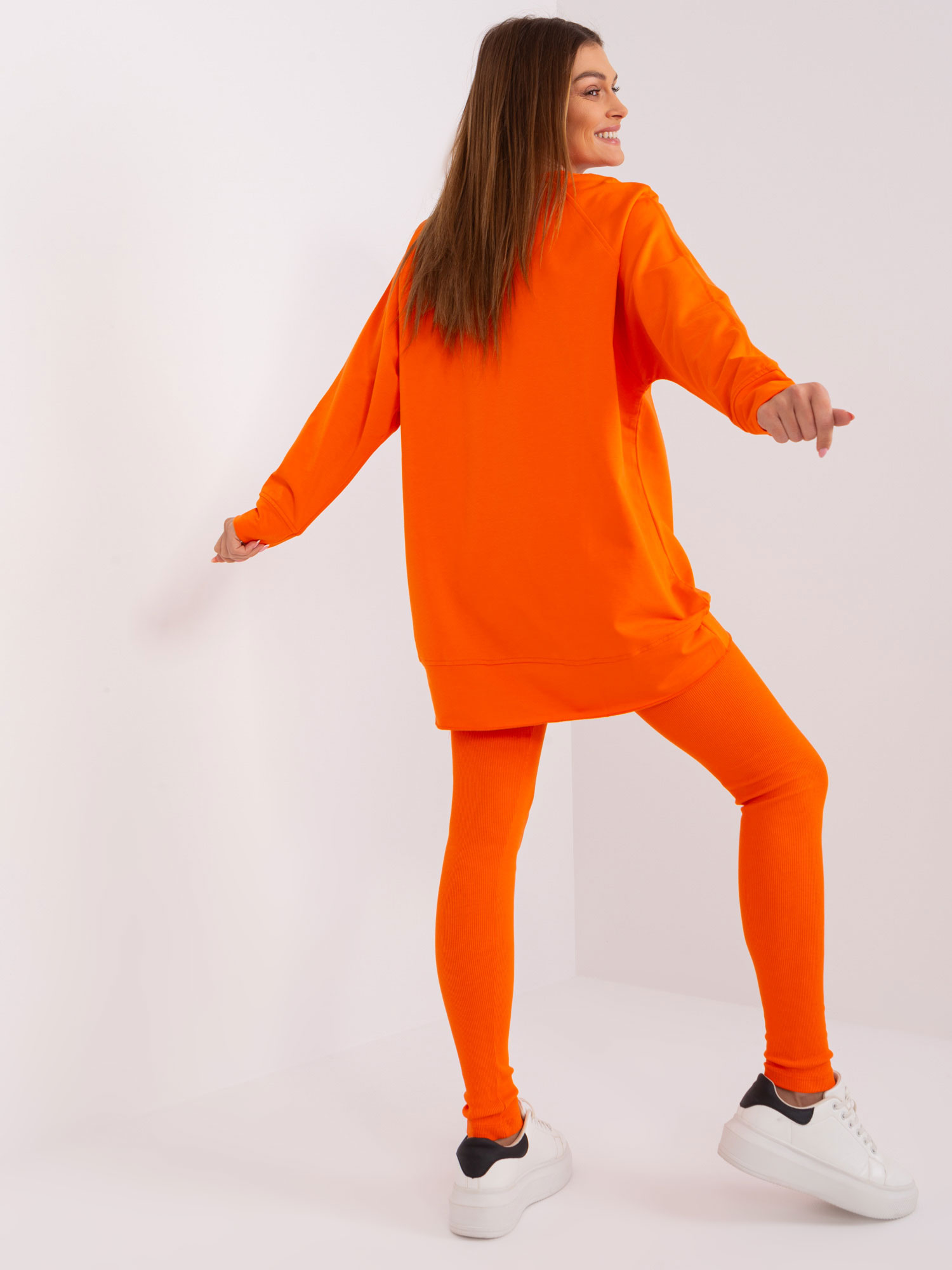 Hurt Orange two-piece set with leggings.