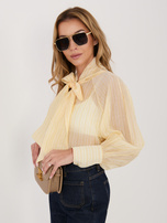 Jasnożółta damska koszula z długimi mankietami