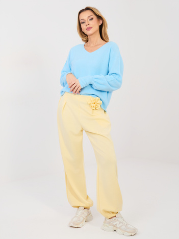 Pastelowe żółte dresowe spodnie typu jogger