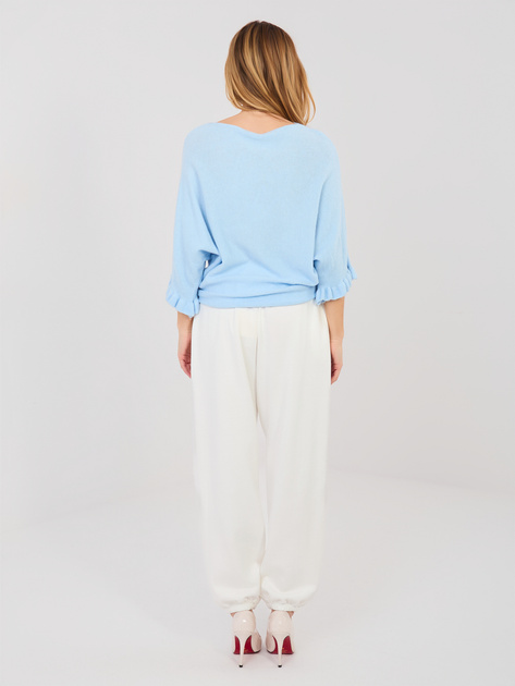 Ecru dresowe spodnie z kwiatową broszką