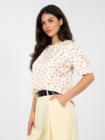 Pastelowa żółta damska bluzka w kwiaty 