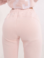 Hurt Jasnoróżowy dresowy komplet damski z ociepleniem