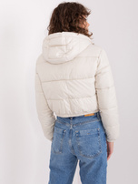 Hurt Light beige short puffer jacket with quilting.