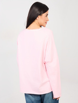 Jasnoróżowa damska bluzka oversize z kieszenią