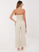 Beżowy elegancki kombinezon z szerokimi nogawkami