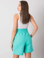 Turquoise Larianna sweat shorts.
