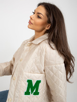 Hurt light beige transitional quilted jacket with a collar.