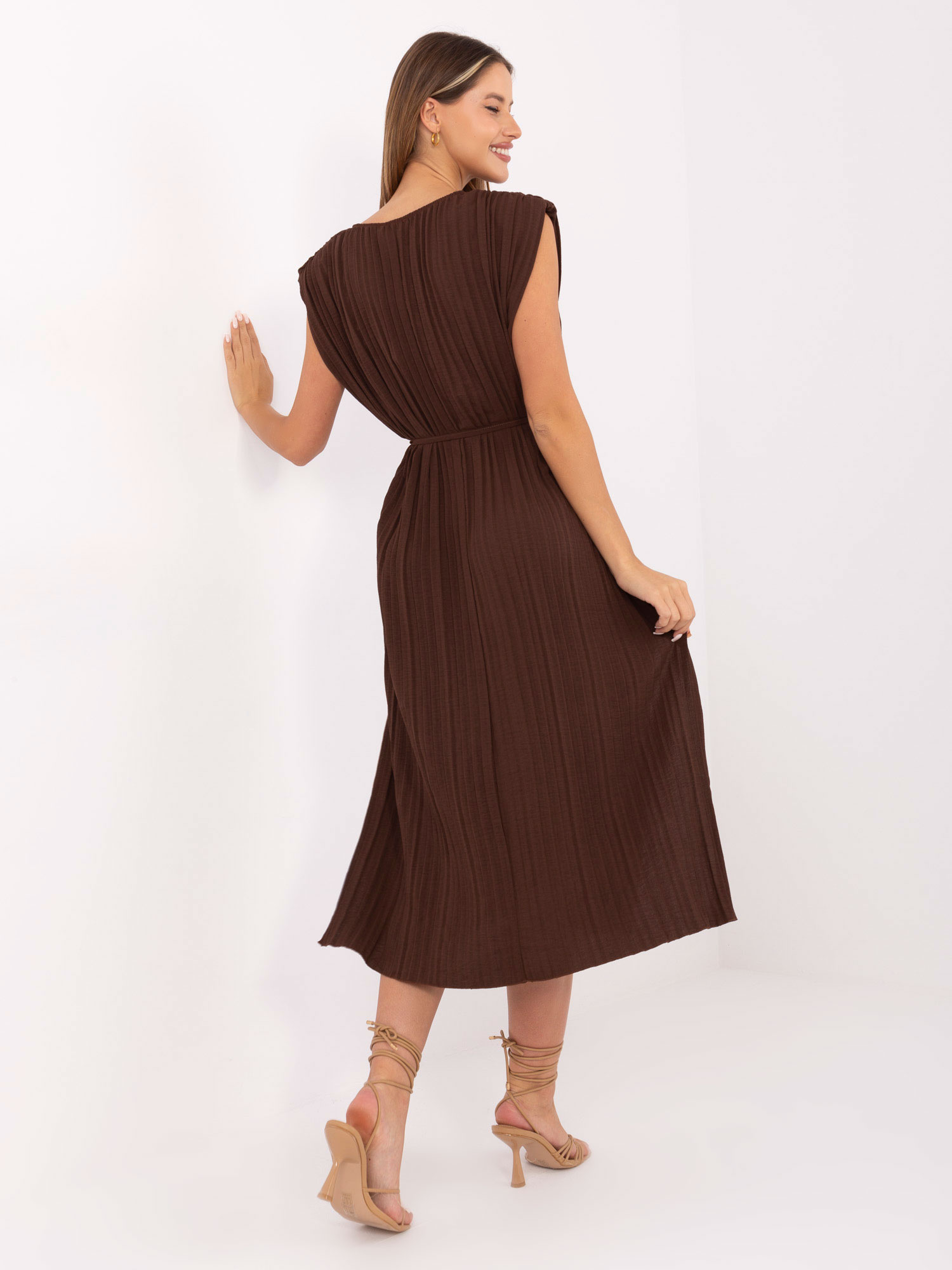 Dark brown midi dress with shoulder pads.