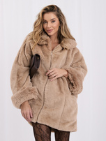 Beige women's fur coat with impressive sleeves.