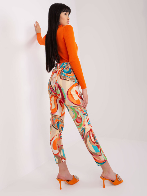 Hurt Beżowe damskie spodnie z materiału z printem