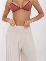 Beżowe letnie spodnie z szeroką gumką 