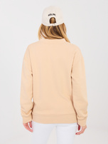 Beżowa bluza oversize z ozdobną naszywką