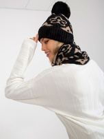 Didmeninė juodai-bežinė moteriška žiemos skrybėlė su pom-pomu.
