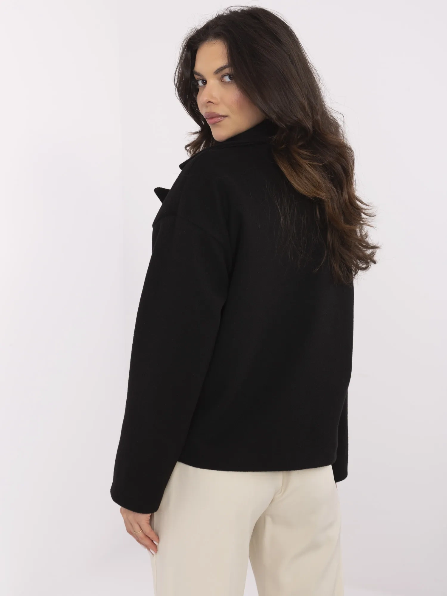 Black short coat with double-breasted fastening.