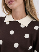 Brown women's polo sweater with polka dots.