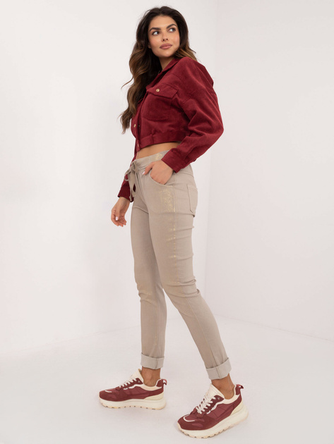 Hurt Beżowe połyskujące spodnie materiałowe z kieszeniami