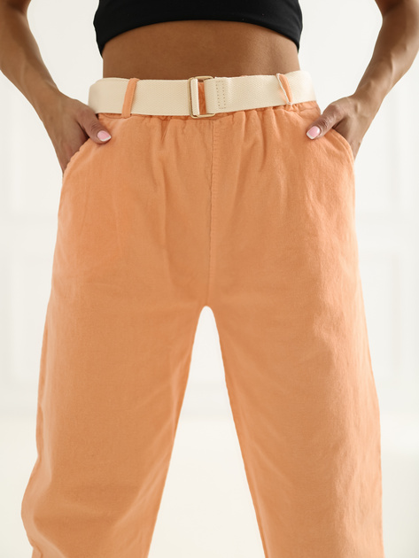 Jasnopomarańczowe sztruksowe spodnie z kieszeniami