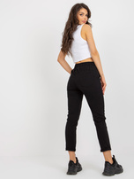 Hurtownia Czarne damskie spodnie dresowe z naszywką