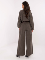 Khaki corduroy pants with a belt.