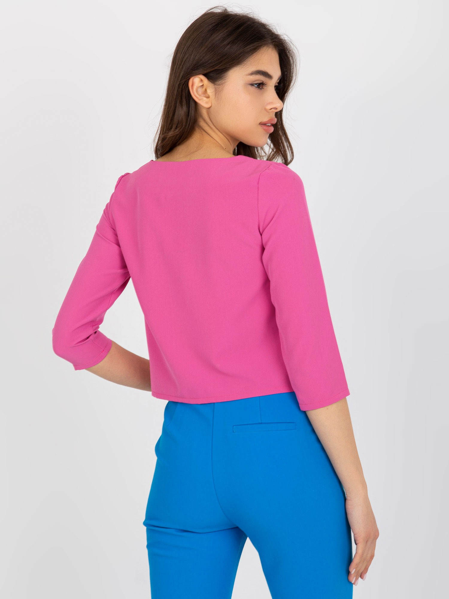 Großhandel Rosa Bluse mit dekorativem Finish.