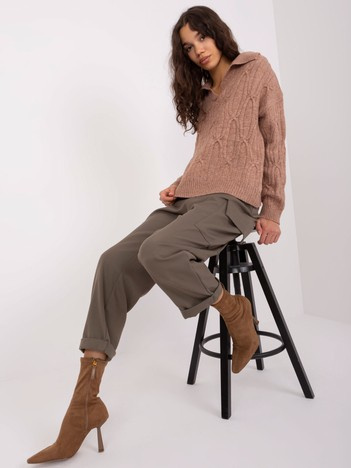 Hurt brown sweater with braids in a loose cut.