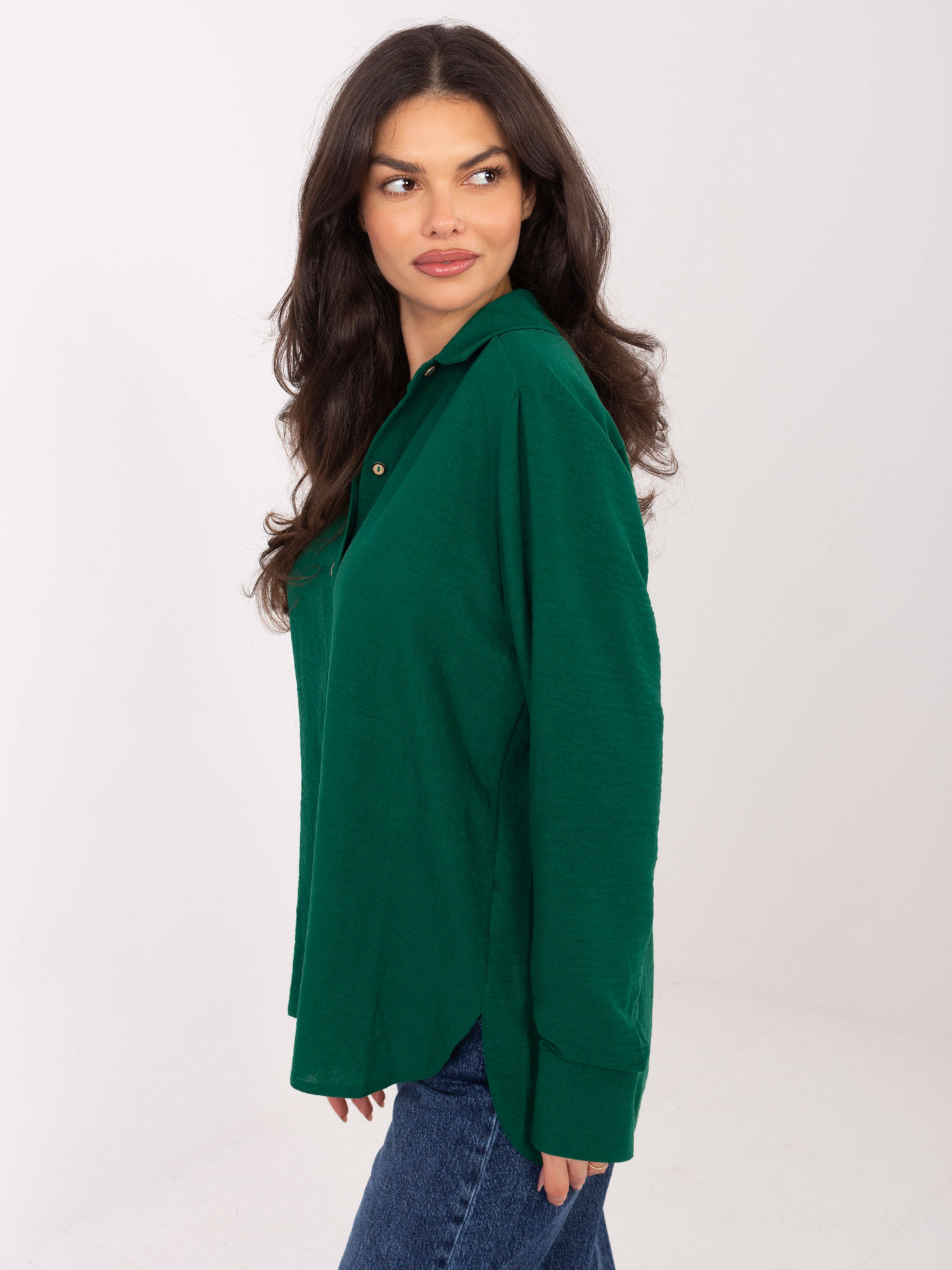 Dark green zip-up cotton shirt.