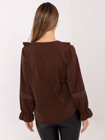 Brown formal blouse with a decorative brooch.