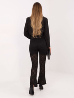 Black lace pants without a fastening.