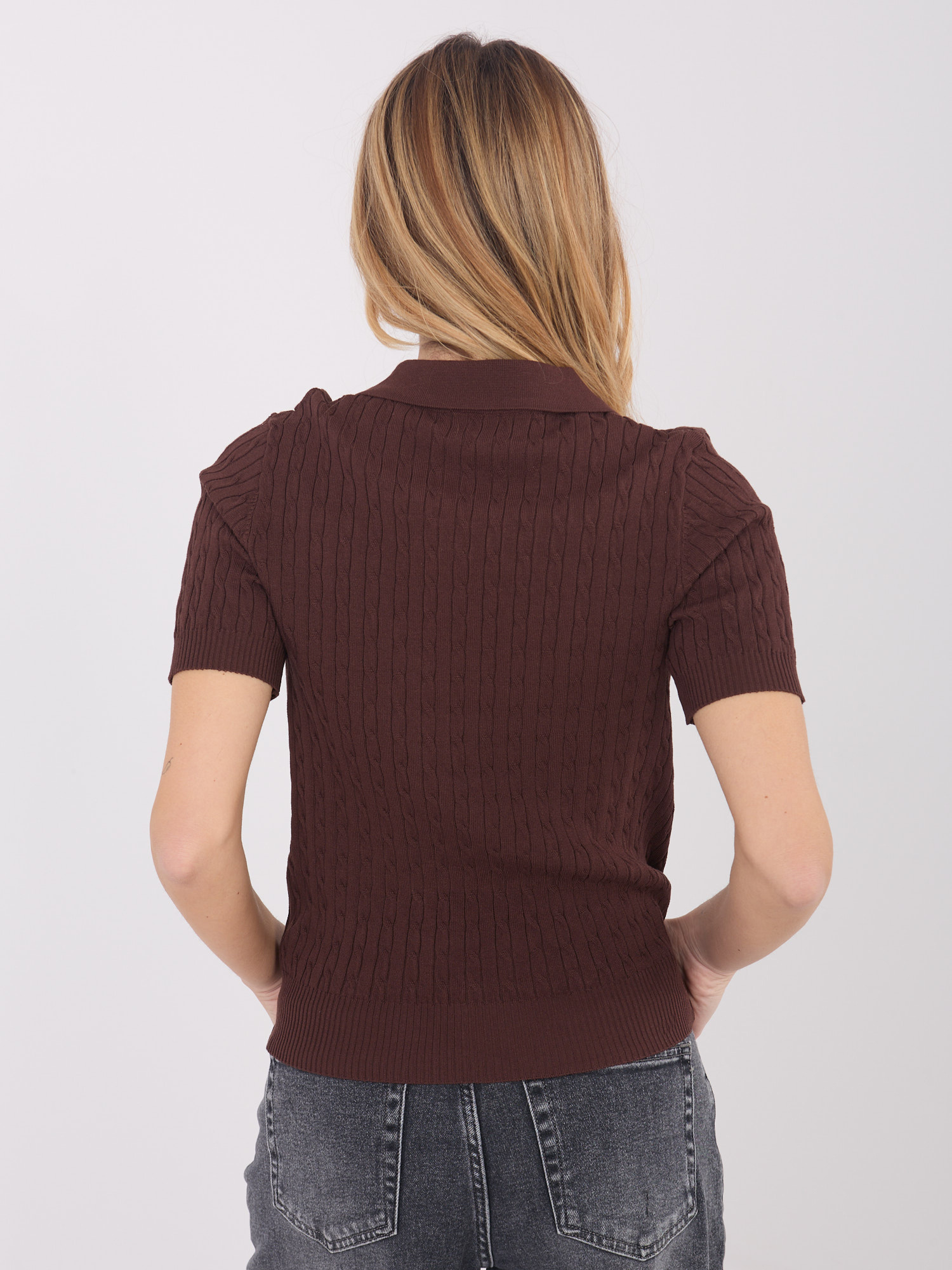 Dark brown women's sweater with a collar.
