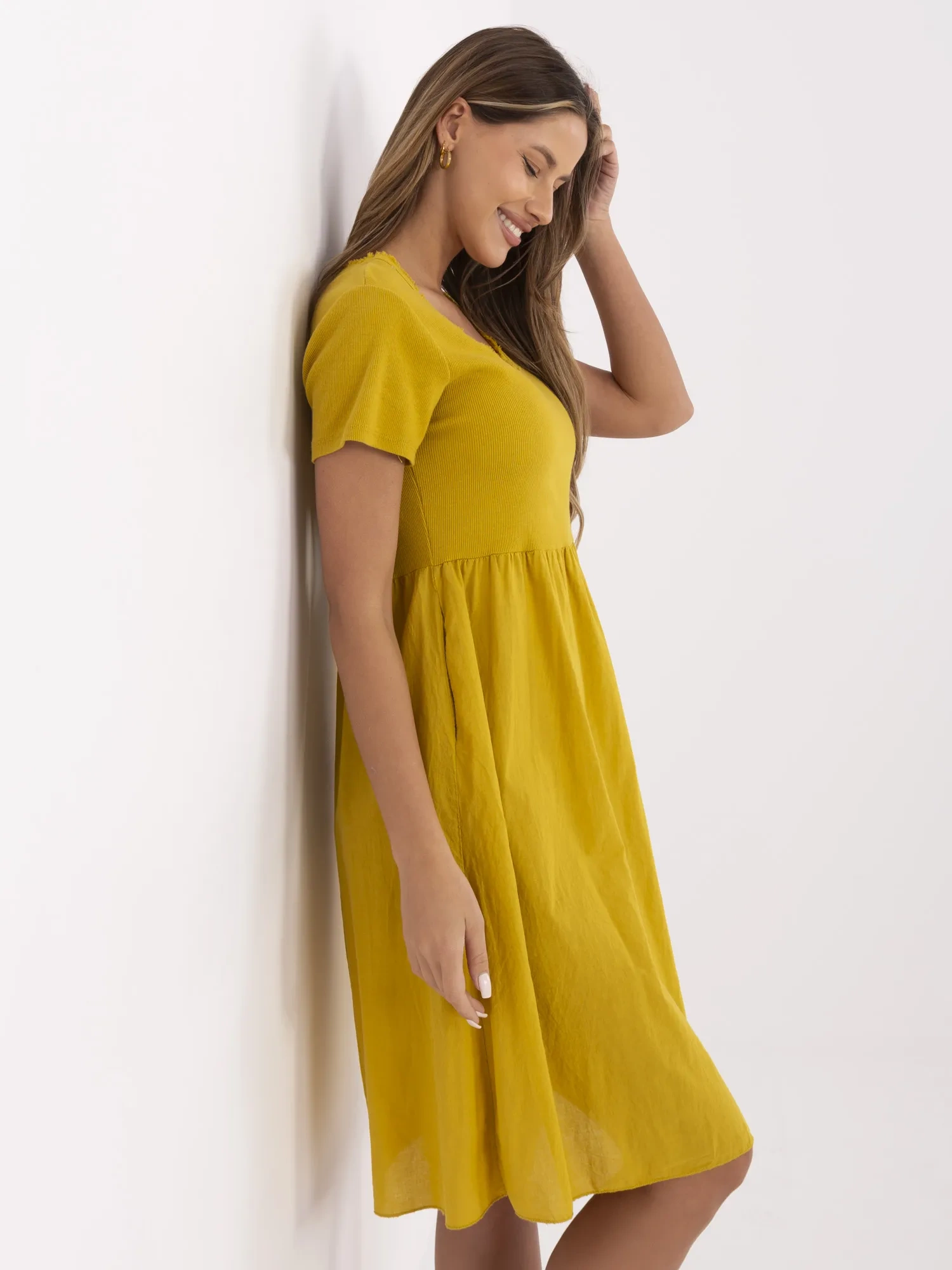 Mustard summer dress with a ribbed top.