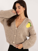 Beige zip-up sweater with a print on the back.