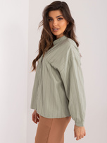 Didmeninė chaki medvilninė oversize marškiniai su mygtukų užsegimu.