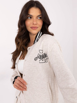 Hurt Jasnobeżowa melanżowa bluza bomberka z naszywką