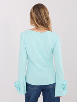 Miętowa bluzka z falbankami przy rękawach
