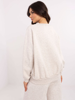 Hurt Jasnobeżowa melanżowa bluza bez kaptura z haftem 