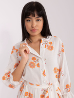 Hurt White-orange patterned dress with a frill.