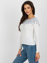 Beige-gray short blouse with exposed shoulders.