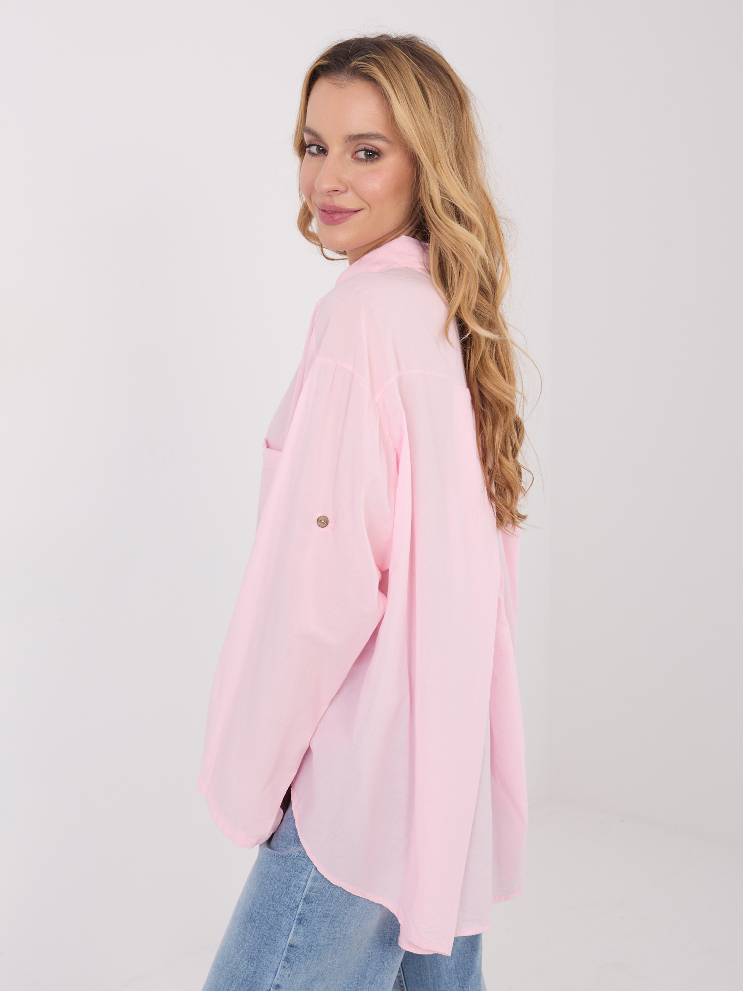 Light pink button-up cotton shirt.