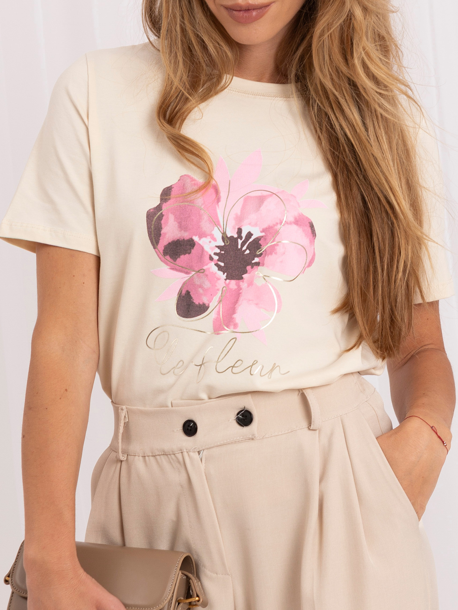 Light beige women's t-shirt with RUE PARIS flower print.