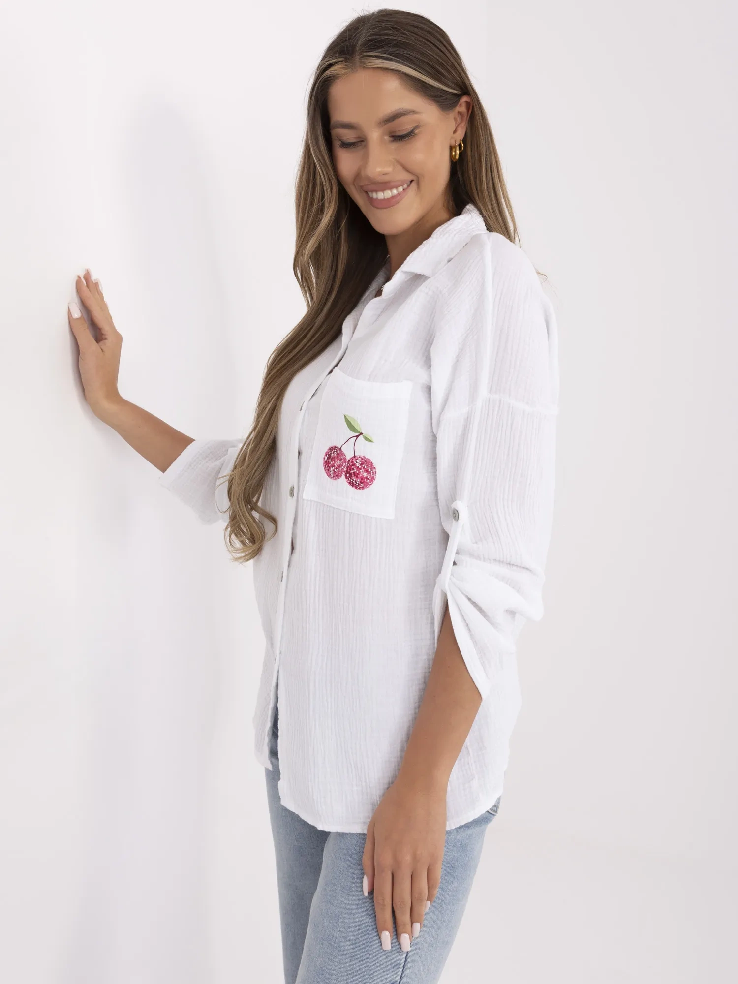 White women's button-up shirt made of muslin.