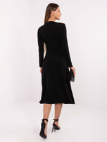 Black trapeze dress with draping.