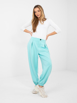 Miętowe dresowe spodnie z zakładkami