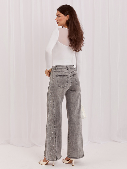 Gray women's jeans with shiny studs.
