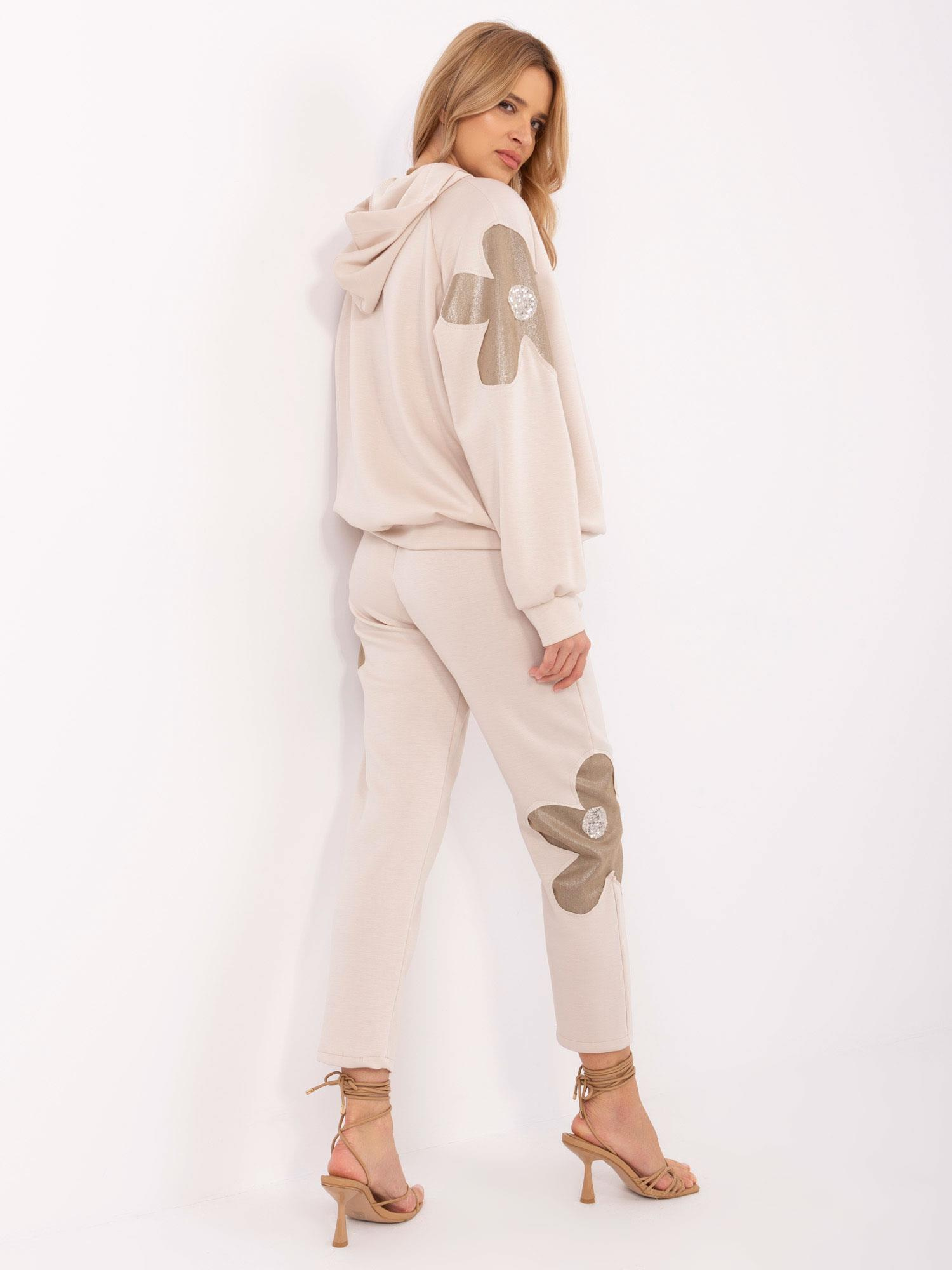 Beige two-piece set with a hooded sweatshirt.