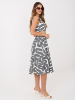 Navy blue flared sleeveless dress.