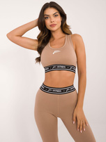 Hurt Ciemnobeżowy sportowy crop top z nadrukiem FOR FITNESS